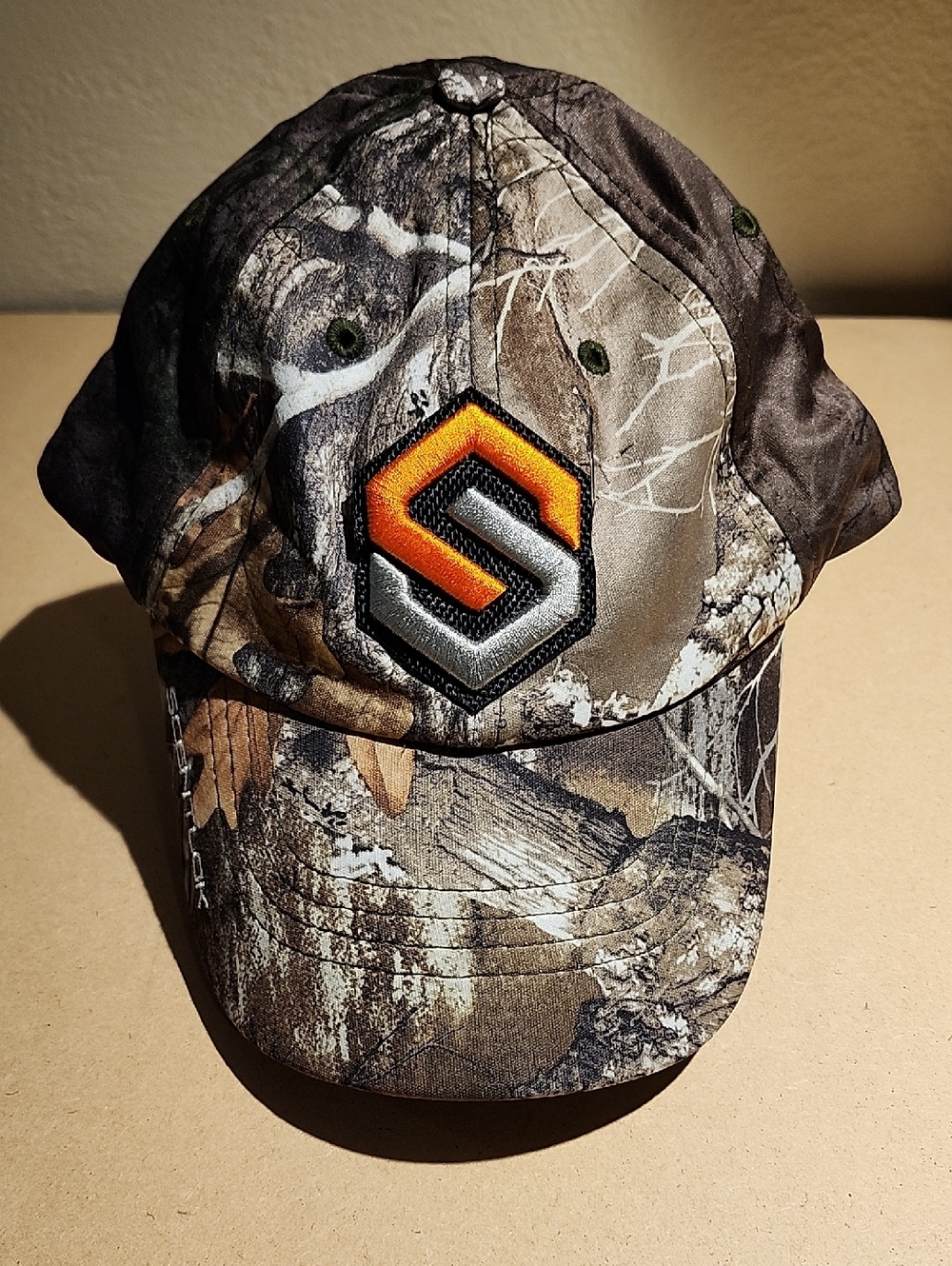 Realtree Camo Ladies Hat with Orange and Silver Logo